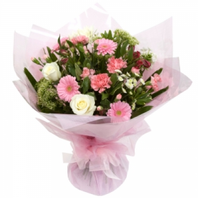 Pretty in Pink - A beautiful hand tied combination of pinks & cream flowers.
