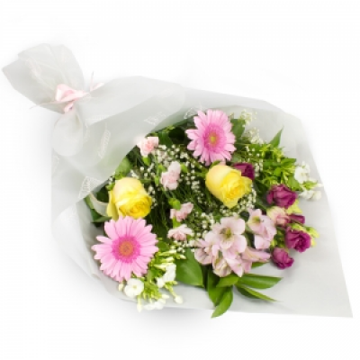 Summer Sunshine - Bright sunshine flowers make this lovely bouquet perfect for any occasion. A collection of seasonal flowers in coordinated wrapping hand delivered by the professional local florist.
