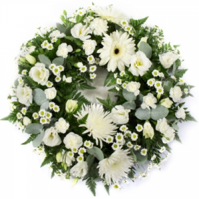 Loose Wreath - Mixed flowers suitable for a lady or a gentleman. Ring wreath for a funeral in creams.  12" €70 / 14" €85 / 16" €95 Important! This type of funeral arrangement needs at least 1 working day's notice for delivery. It is not possible to make and deliver an item like this same day. 