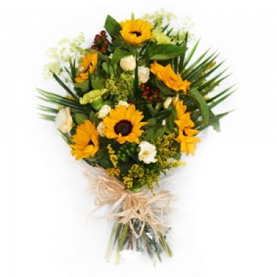 Funeral Flowers in Cellophane - Funeral flowers in cellophane using bright shades of yellow, white and green. 
