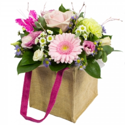 Hugs and Kisses - This petite flower filled gift bag says welcome perfectly.
