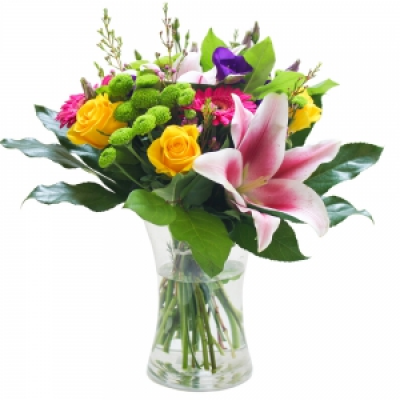 An Elegant Vase - A lovely selection of flowers and foliage arranged in a glass vase.
