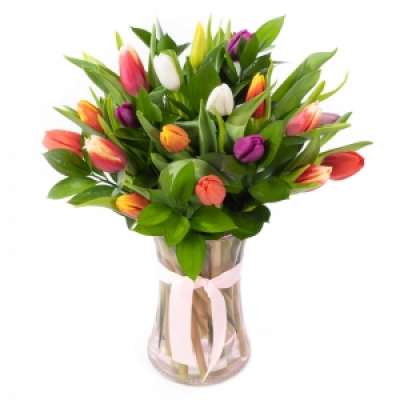 Spring Kisses - For that fun person in your life that likes to be different, this glass vase filled with beautiful tulips sends the perfect message.
