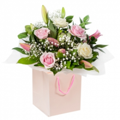 Special Thoughts - A soothing collection of Roses and Lilies delicately crafted and delivered by a professional florist. Make their heart melt 
