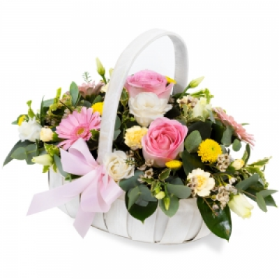 A Country Basket - A pretty collection of pastel flowers skilfully arranged in a delightful basket to deliver your message in a special way.  Handmade and delivered on the day by a local florist. 
